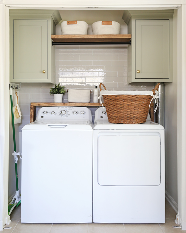 DIY laundry closet makeover with green cabinets, esll organization, floating shelf, and basket organization