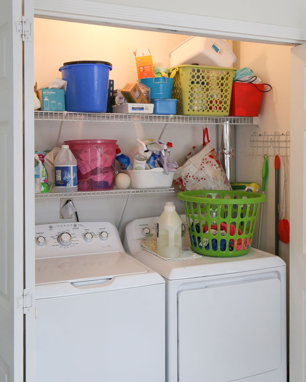 BEFORE makeover of messy laundry closet