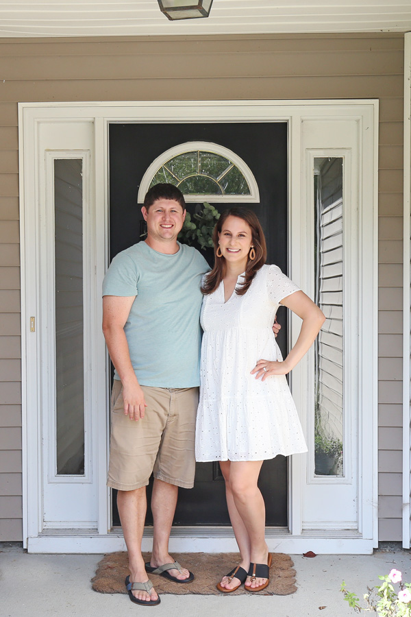 couple in front of door of new house