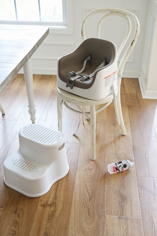high chair, step stool, and spilled water on new pergo laminate flooring