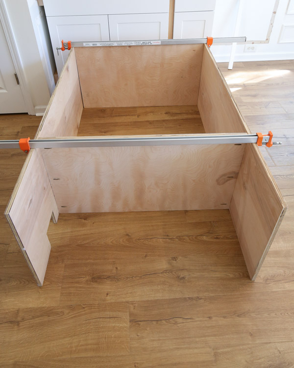 assembling the top of the built in cabinet together with long clamps