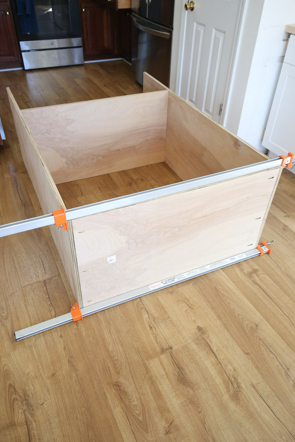 assembling the top of the built in cabinet together with long clamps