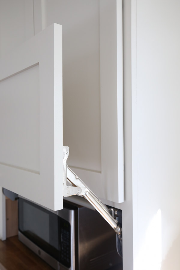 cabinet door sitting right above top of kitchen appliance garage cabinet