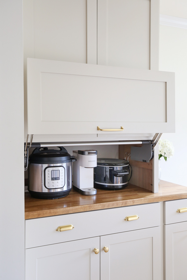 open DIY appliance garage cabinet storing small appliances