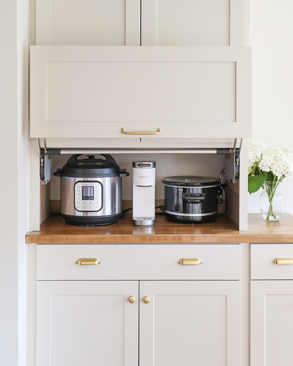 kitchen appliance garage DIY storing an instant pot, coffee maker, and crock pot