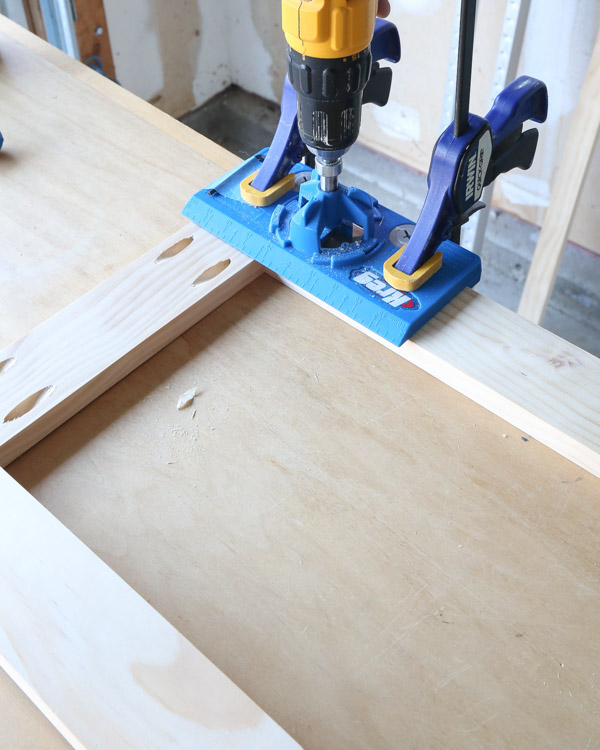 drilling holes for the door hinges on the cabinet door frame with kreg concealed hinge jig