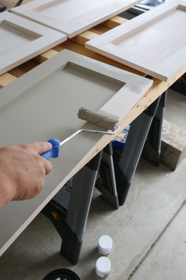 painting the DIY garage cabinet doors with Dorian grey paint by sherwin williams