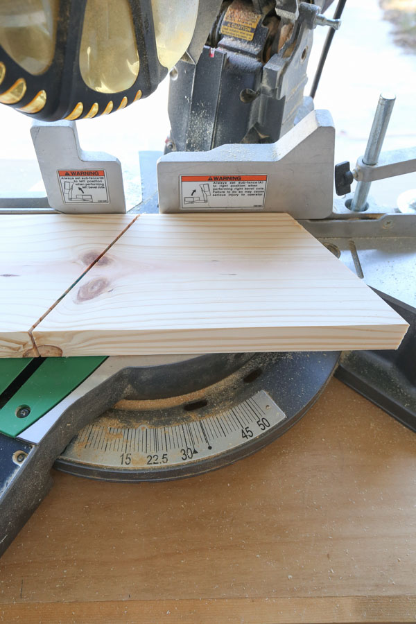 Cut the angled boards for the middle of the wood Christmas tree with miter saw