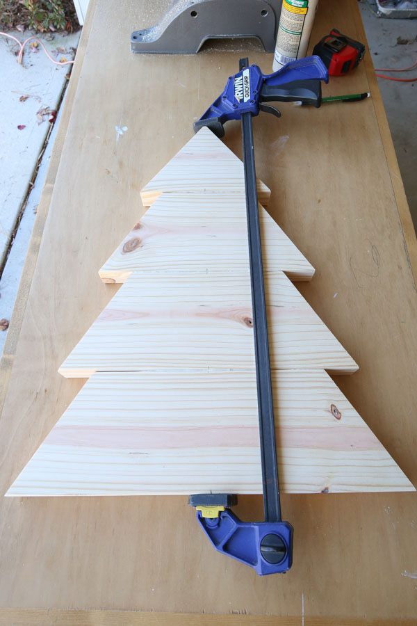 clamping the wood DIY christmas tree boards together with wood glue