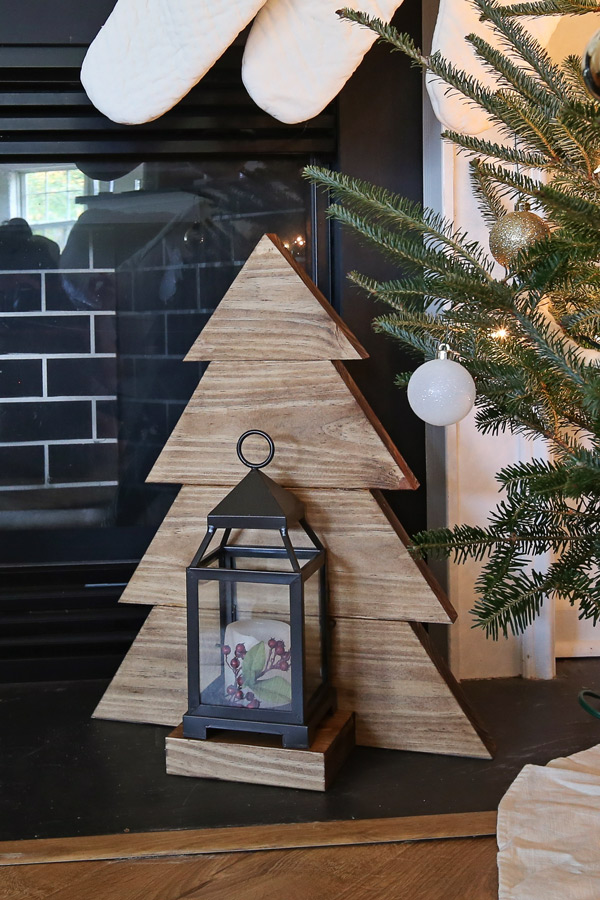 DIY wooden Christmas tree in front of mantel