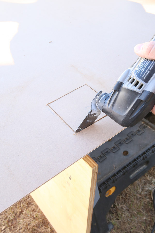 using a dremel to cut hole out of back of beadboard panel for outlet