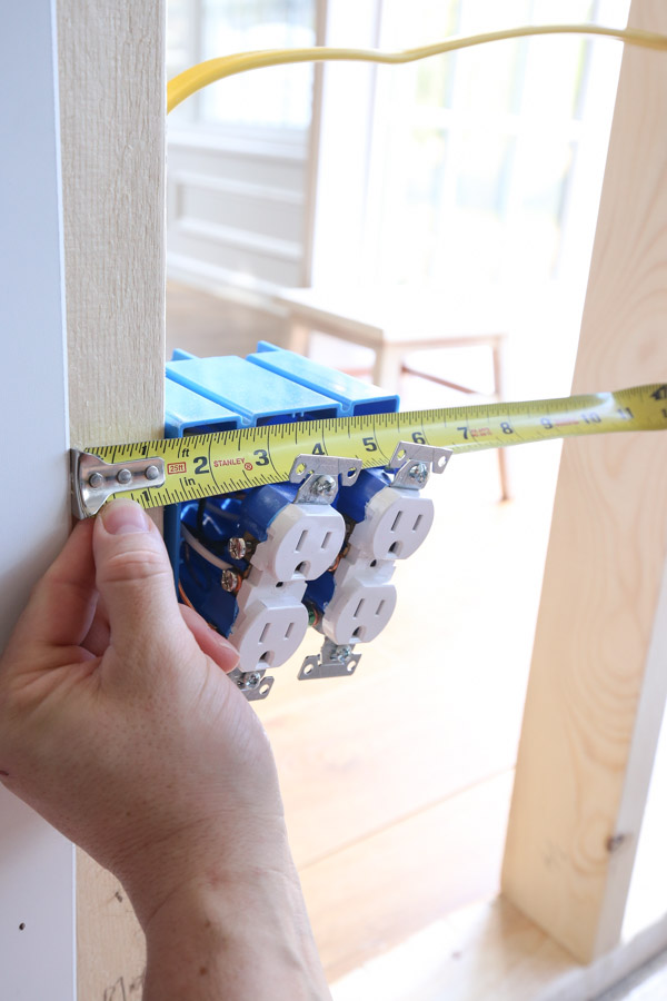 measuring outlet to cut hole out of beadboard panel