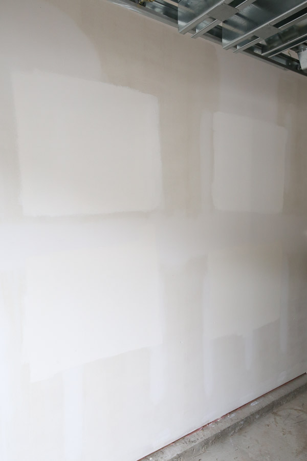 testing out white garage wall paint color samples on garage wall