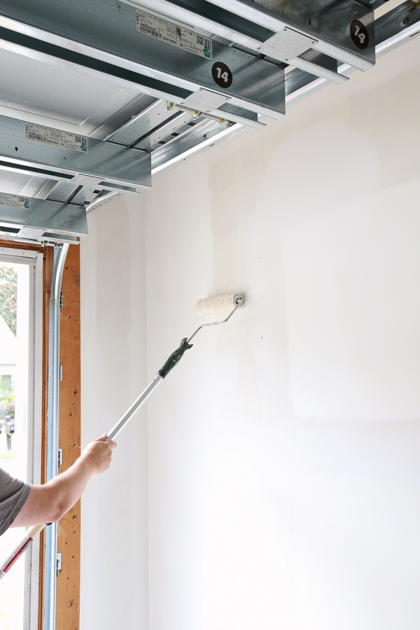 painting garage wall pure white by sherwin williams with roller