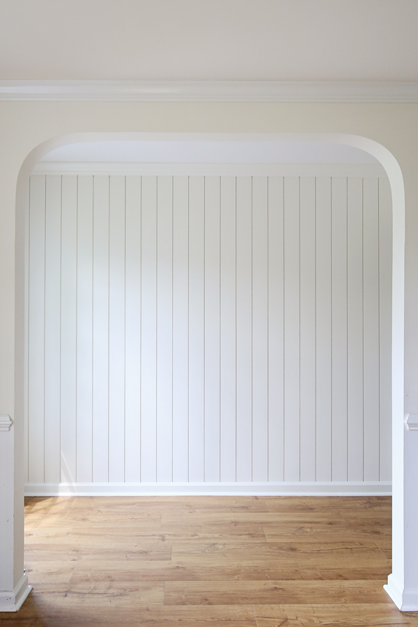 vertical shiplap wall painted white