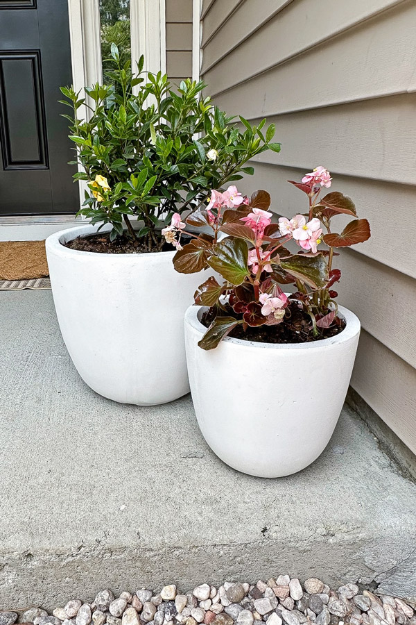 set of two concrete outdoor planters on porch from amazon that are budget friendly