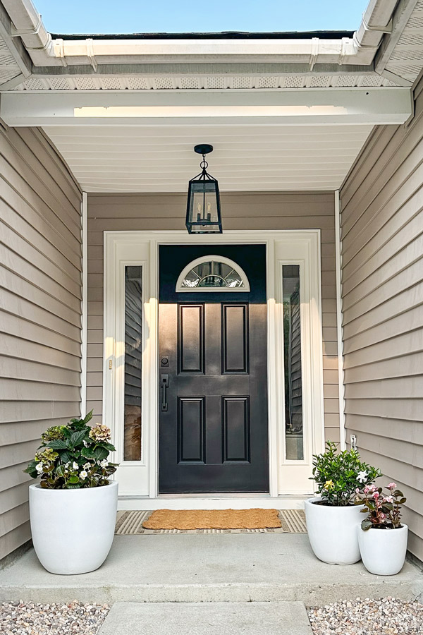 small front porch makeover ideas with front door painted tricorn black by sherwin williams