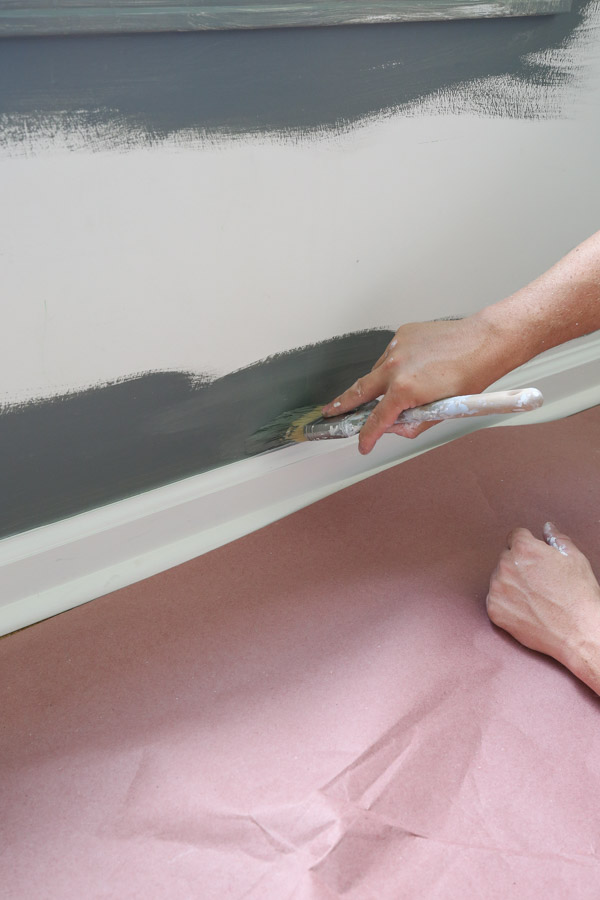 cut in accent wall with a paint brush and paint along baseboard and wall edges