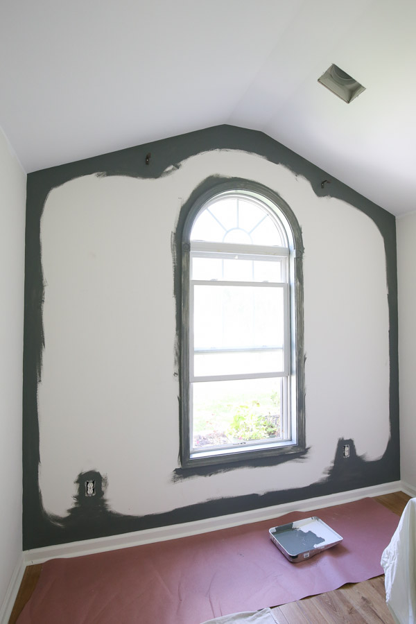 edges of DIY painted accent wall cut in with dark paint