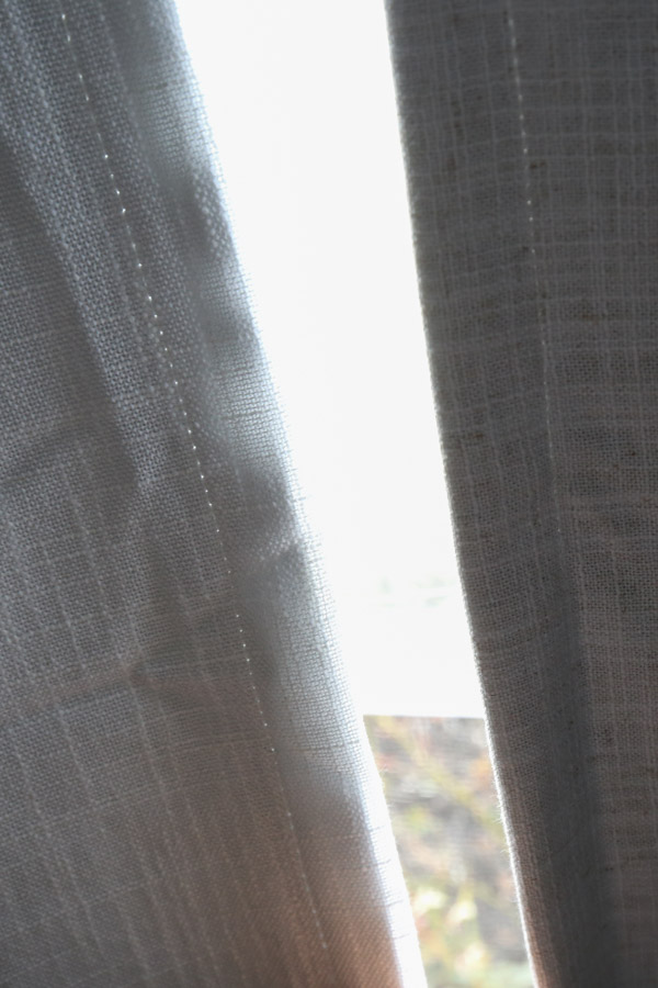 comparing hemmed edges of two curtain options