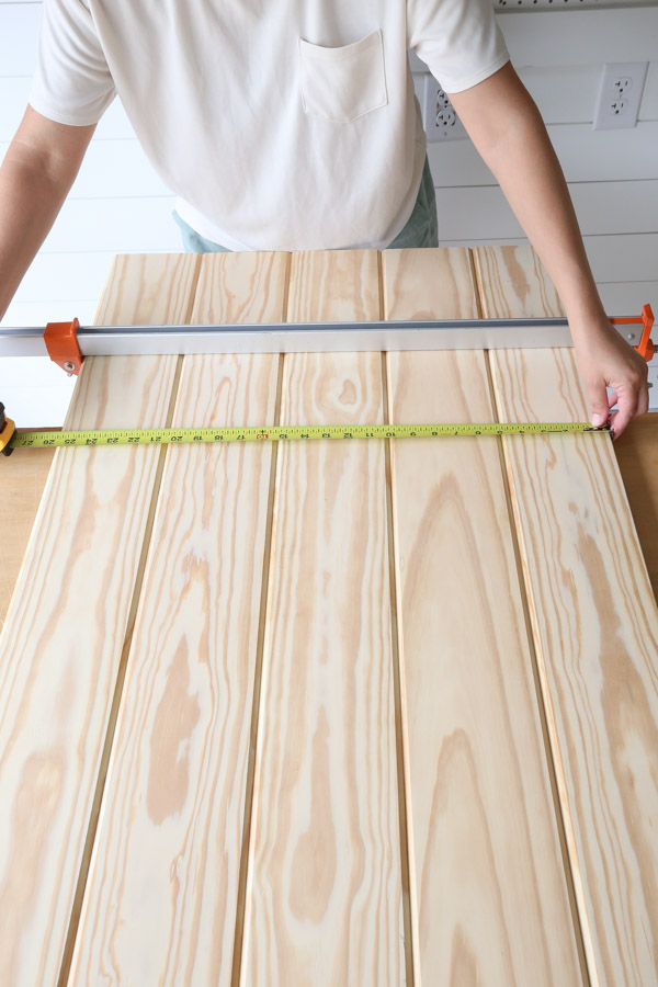 measuring width of shiplap boards joined together for shiplap headboard