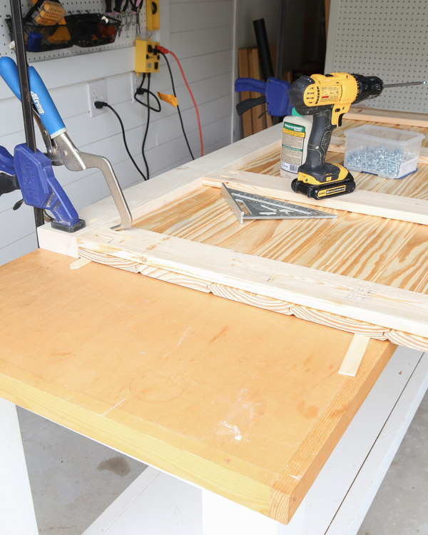 attaching the 2x4 headboard frame to shiplap with pocket holes and kreg screws