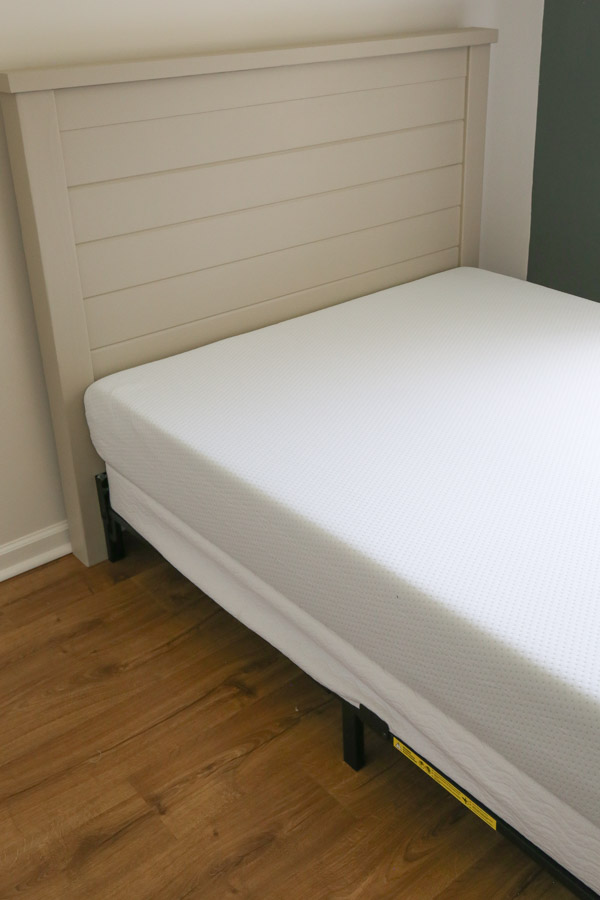 new mattress and box spring on bed frame attached to DIY shiplap headboard
