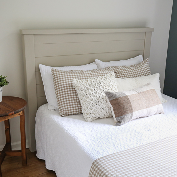 DIY shiplap headboard with white and gingham bedding