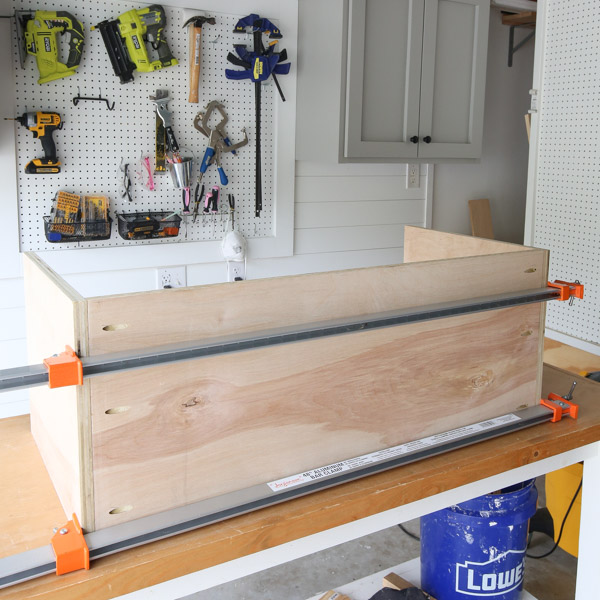 assembling the diy office storage cabinets with clamps