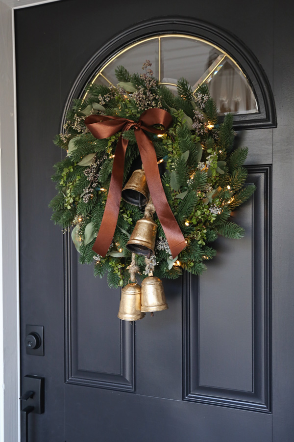 minimalist Christmas wreath DIY with brown satin ribbon and vintage brass jingle bells