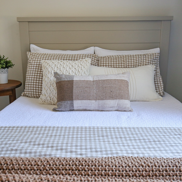 how to layer a bed with cozy layered bedding ideas with neutrals, cream, and brown colors