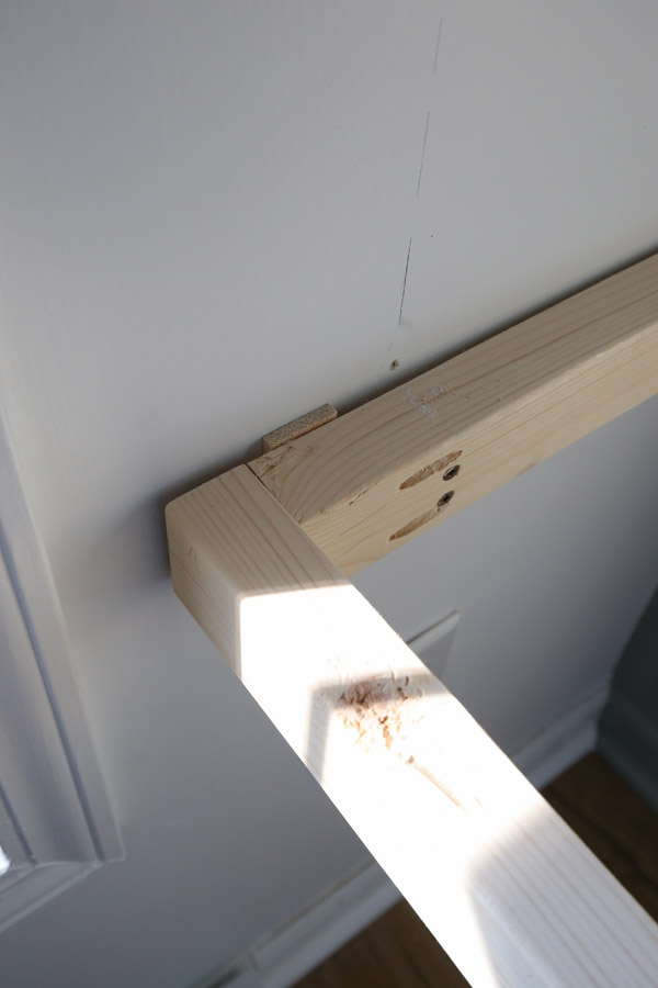 using a wood shim for attaching the built in desk diy frame
