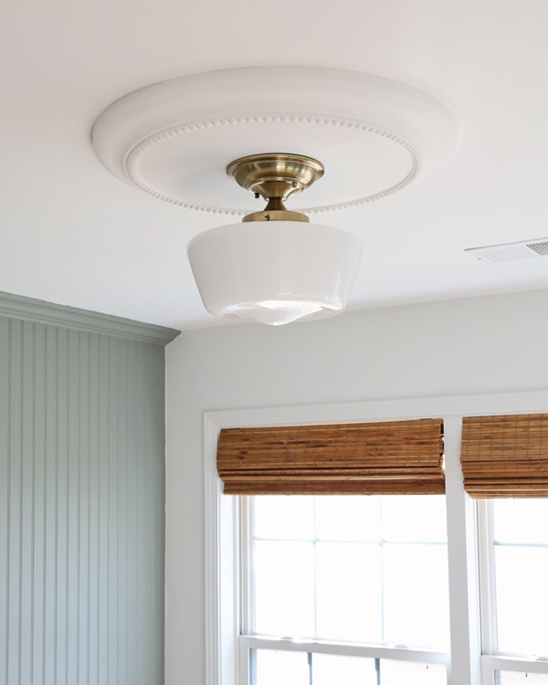 installing a round ceiling medallion in office makeover with brass semi flush mount light