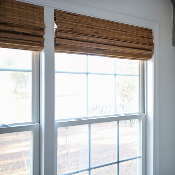 budget friendly bamboo blinds from amazon and DIY window trim between windows
