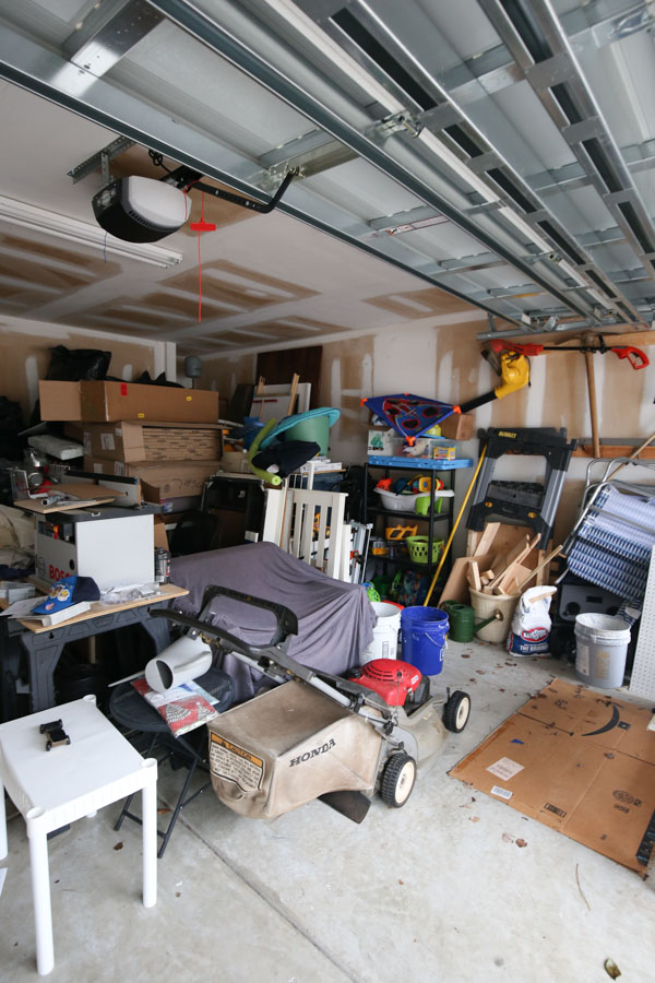 messy garage before garage shelves and makeover
