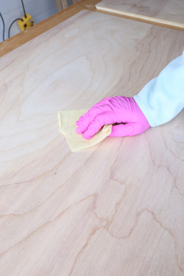 using tack cloth to remove saw dust from plywood