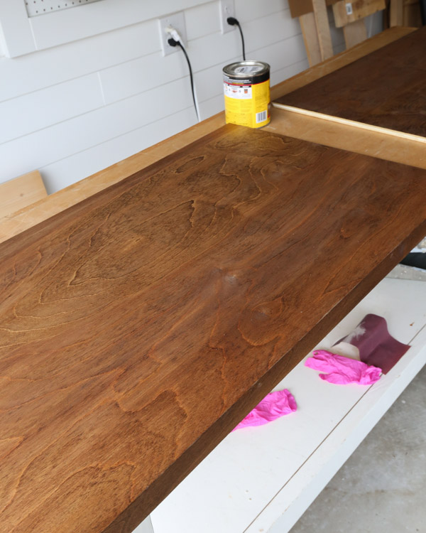 first coat of stain drying on birch plywood desk top