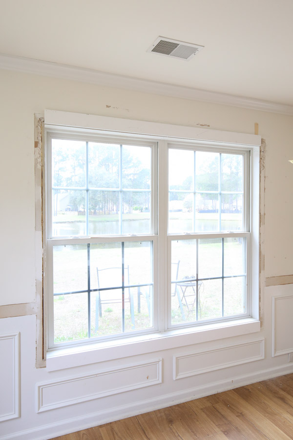 top trim and bottom trim boards installed on window for DIY window trim