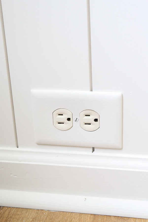wall outlet over DIY shiplap