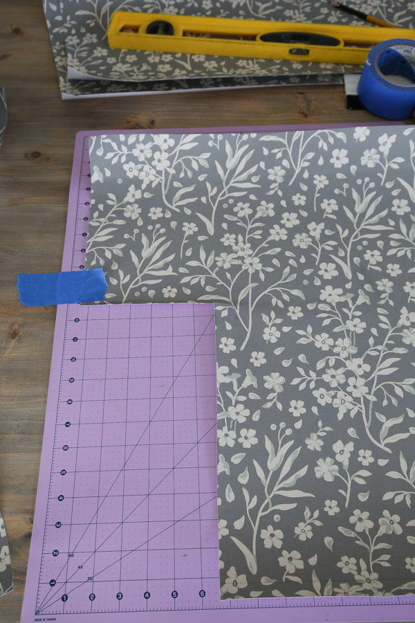 cutting wallpaper to size for installing around a window