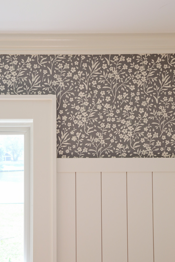 green floral DIY peel and stick wallpaper above vertical shiplap