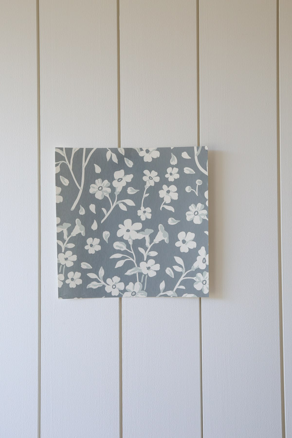 sample of green and white floral wallpaper on shiplap