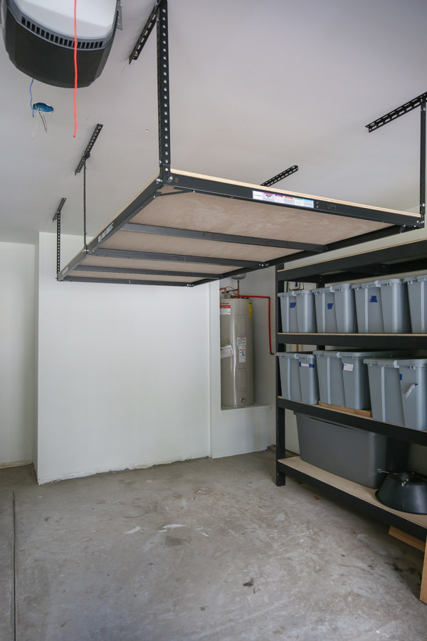 plywood installed on the DIY Garage Ceiling Storage shelves frame