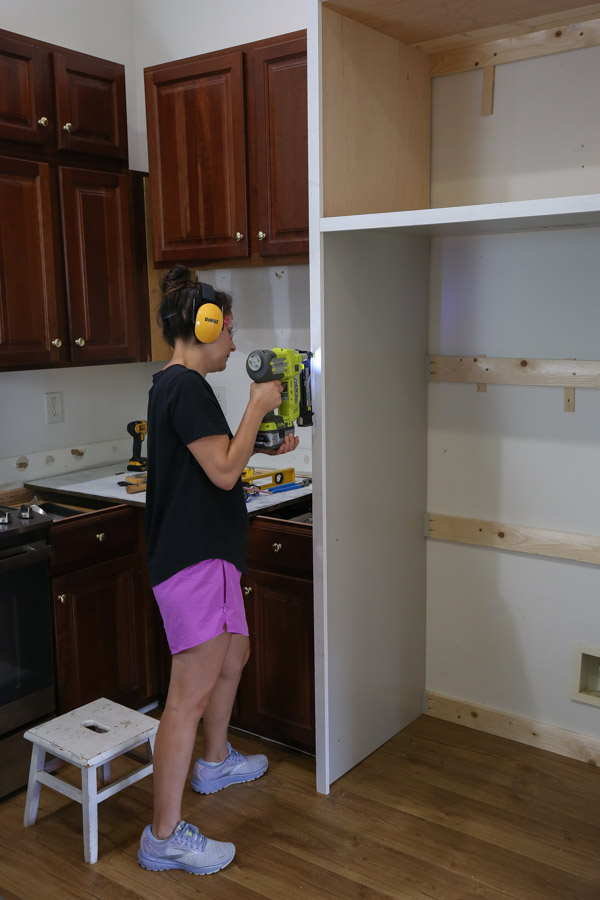 installing face frame to diy built in refrigerator cabinet surround frame with brad nailer