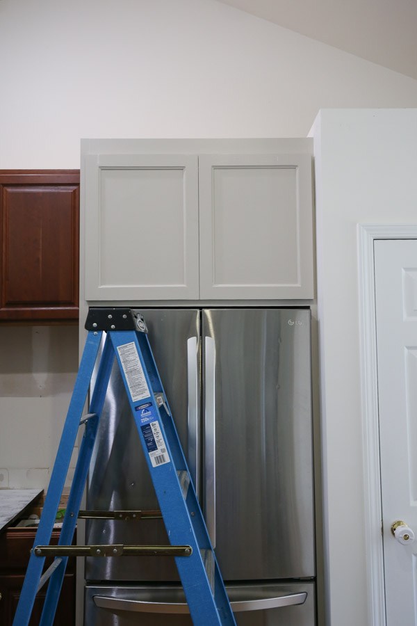 cabinet doors attached to top of diy refrigerator cabinet