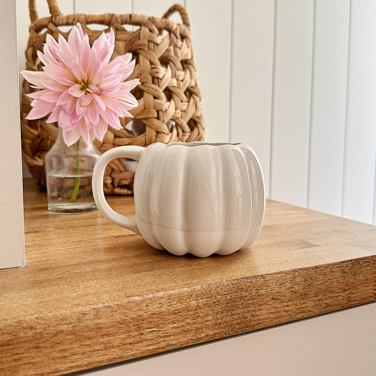 Antrhopologie ceramic pumpkin mug for fall on butcher block counter top