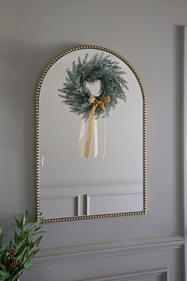 Christmas mirror decoration ideas using Christmas wreath with velvet bow ribbon on wreath