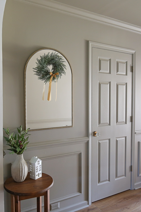 Christmas decoration ideas for mirrors in entryway with faux cedar wreath