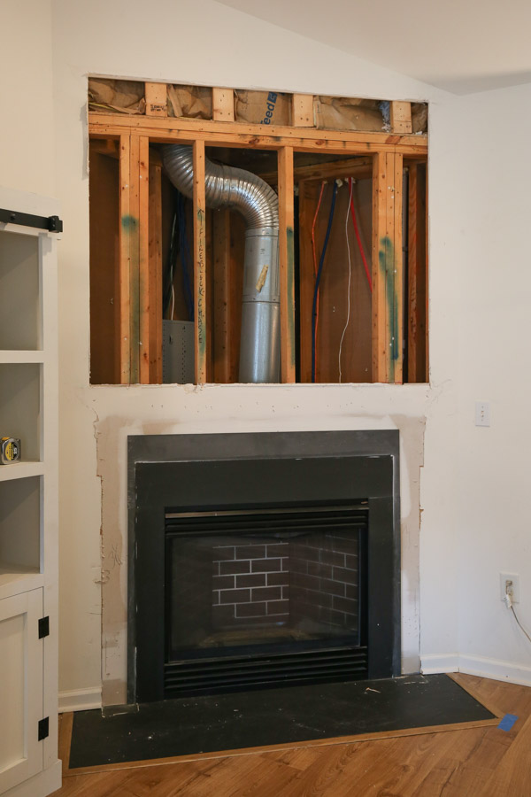 drywall removed above fireplace
