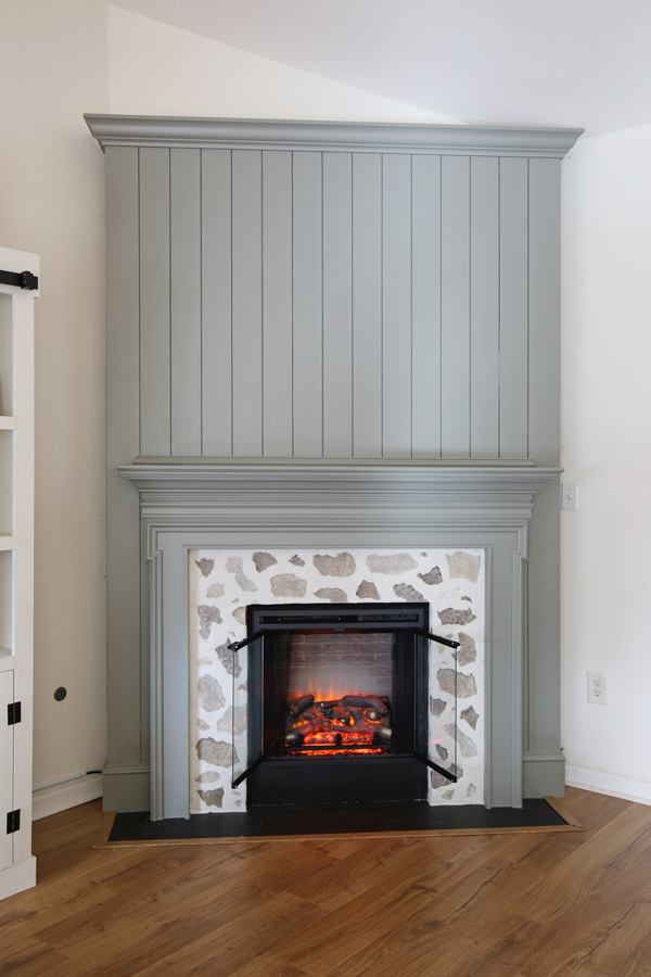 DIY shiplap fireplace with a faux stone fireplace DIY surround before decor